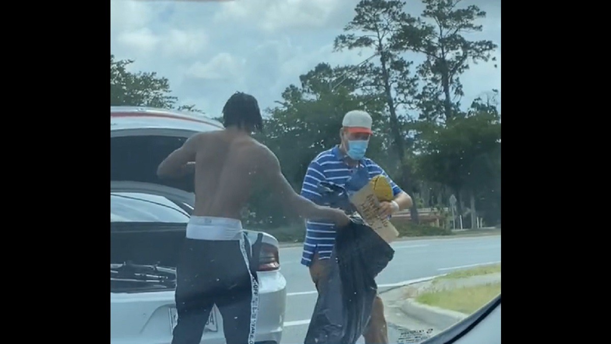 Student Gives his Stuff Away to Homeless Man on the Road