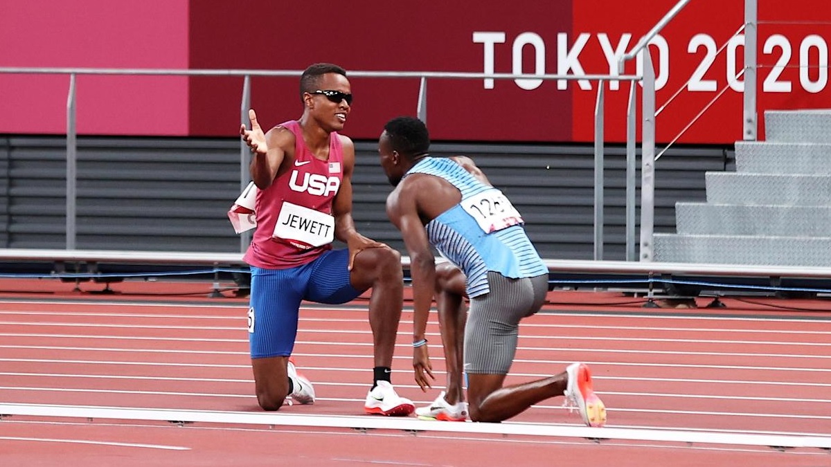 Olympic athletes help each other to finish line after falling
