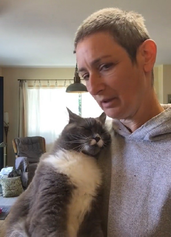 Cuddly cat loves snuggling with mom before she leaves for work