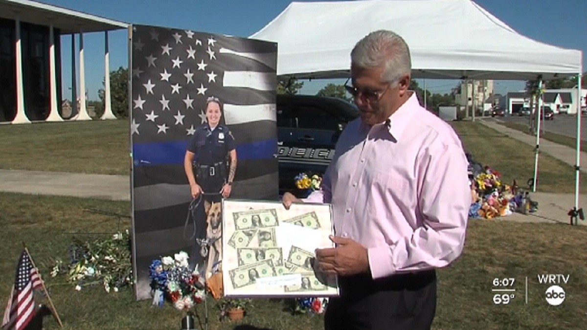 Community gives back to homeless people who donated to a slain officer's family