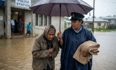 Officer Rescues Shivering Elder from Flood Rain