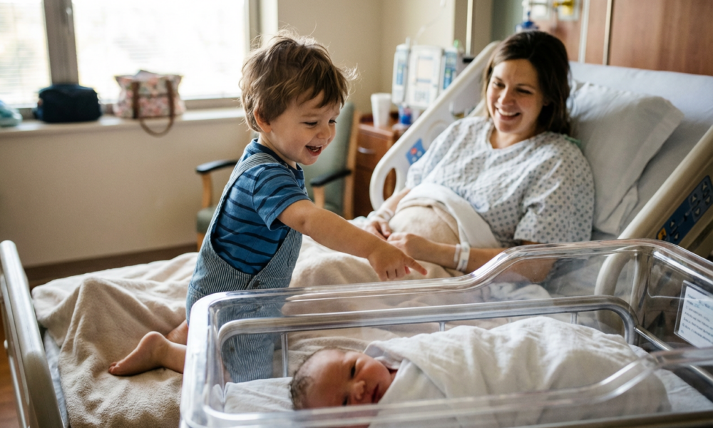 This Little Boy's First Reaction to His New Baby Sister Is Pure Sunshine and Will Melt Your Heart