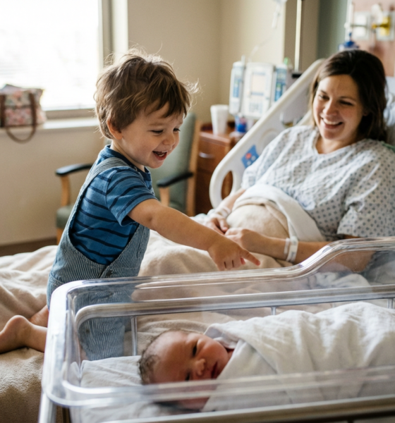 This Little Boy's First Reaction to His New Baby Sister Is Pure Sunshine and Will Melt Your Heart